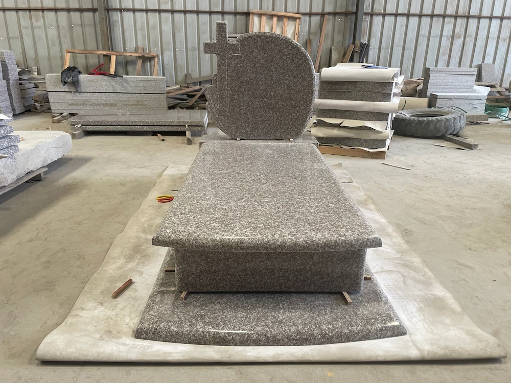 G664 Polish-style granite wave headstone with full ledger cover and raised base