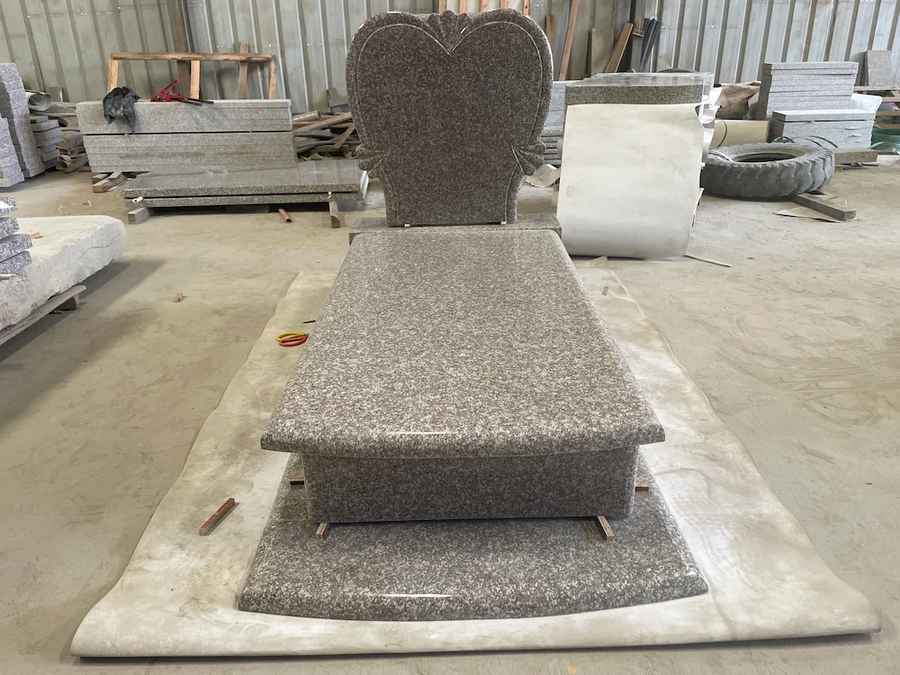 G664 Polish-style granite heart headstone with full ledger cover and raised base