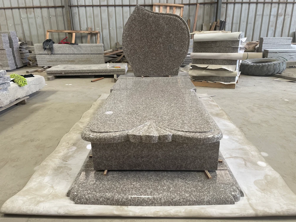 G664 Polish-style granite wave headstone with full ledger cover and raised base