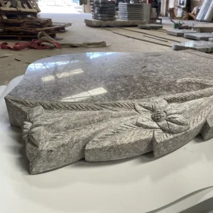 G664 Romanian Headstone with flower carving