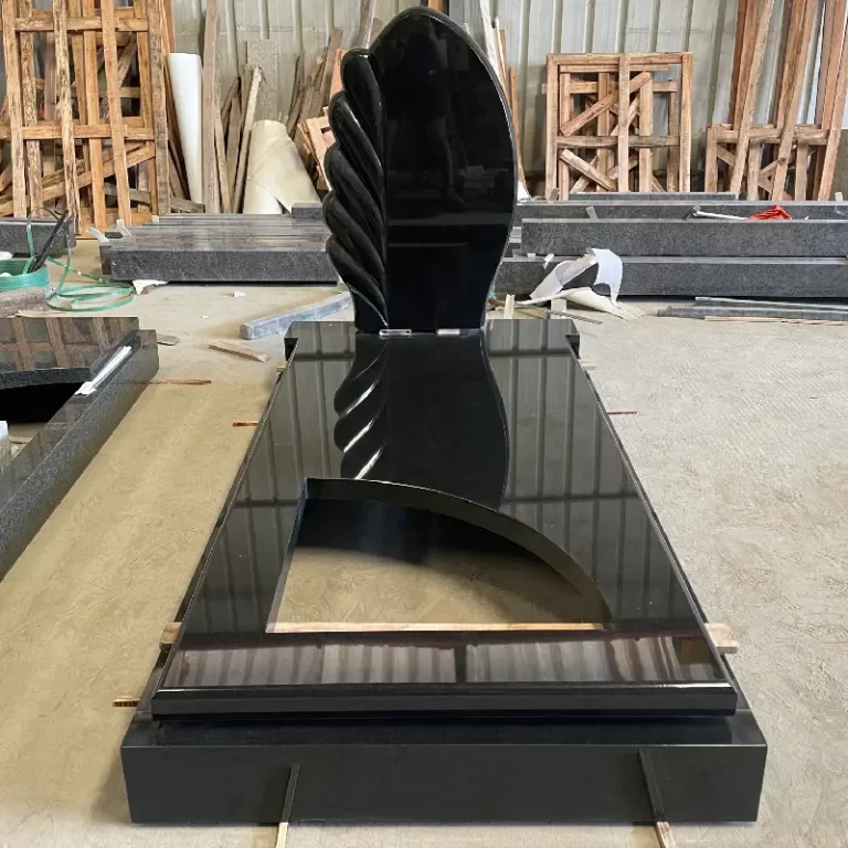 Indian Black granite German-style tombstone with wing-shaped headstone and polished wave cover slabs