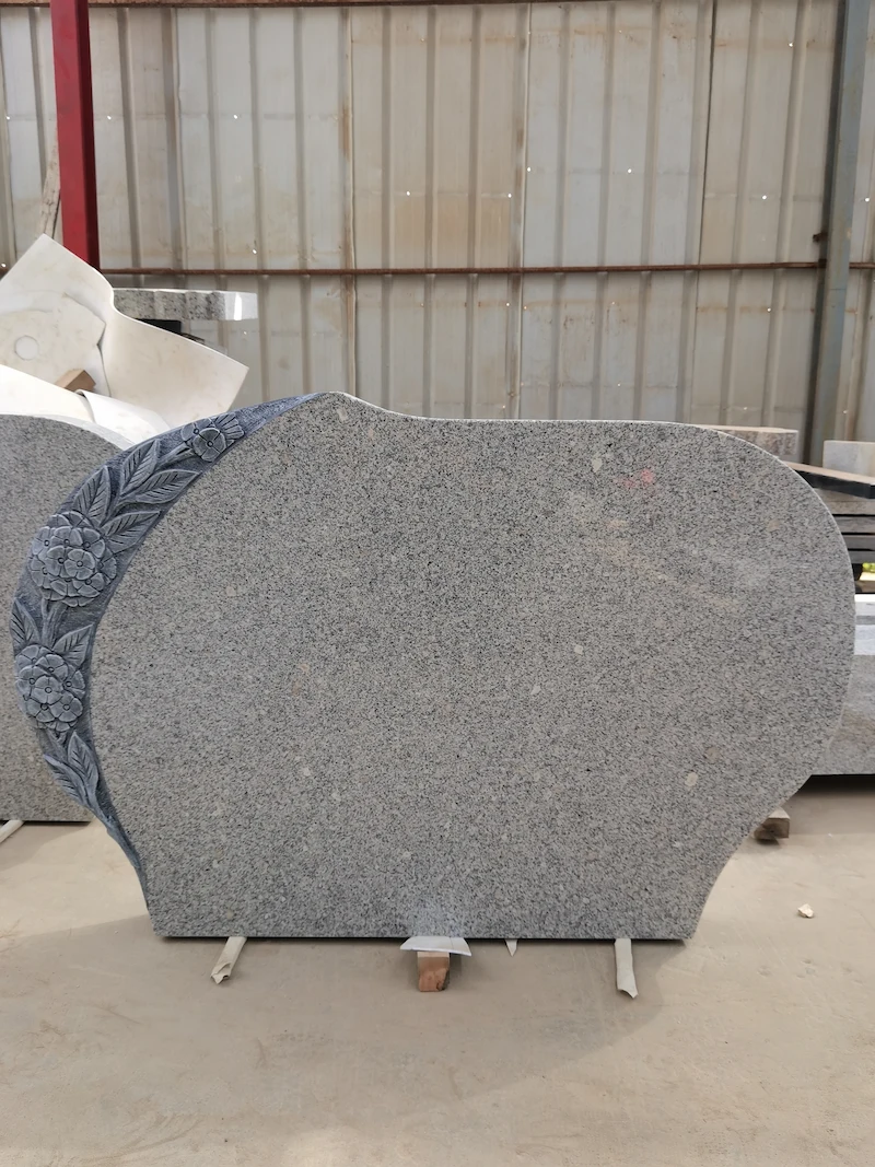 G603 granite flower carving headstone with curved inscription panel and leaf detail