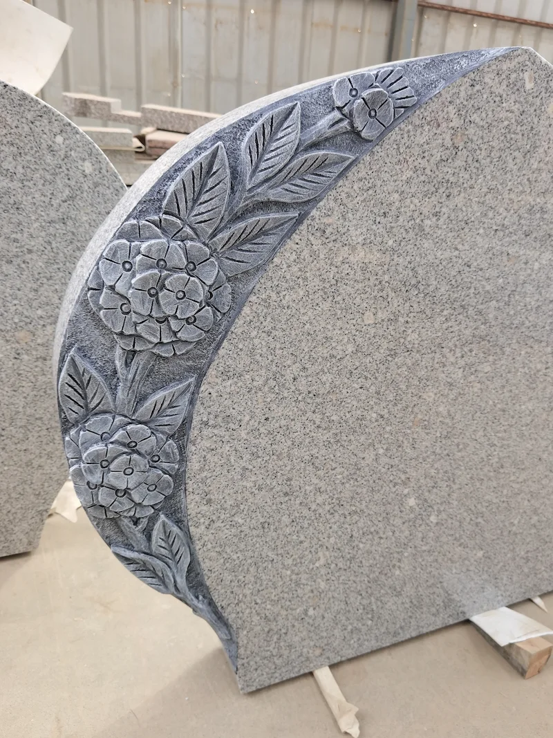 G603 granite flower carving headstone with curved inscription panel and leaf detail